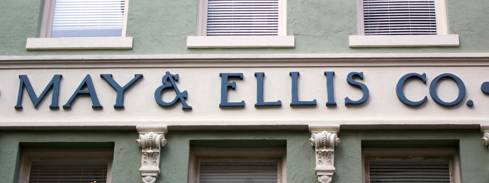 Storefront type and signage for May & Ellis Co.